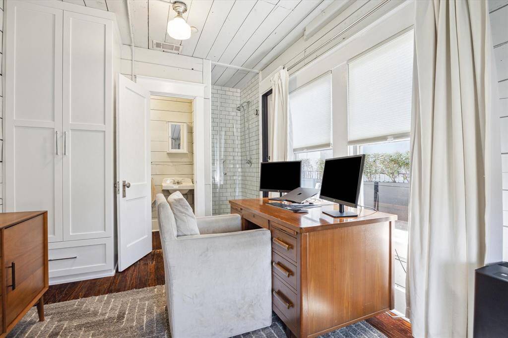 This view shows the built-in storage closet, walk-in shower and private water closet.