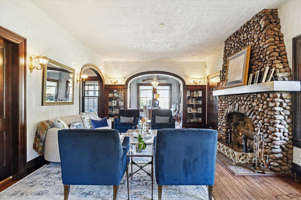 This view of the living room shows the depth of the space and the grandeur of the features and finishes.