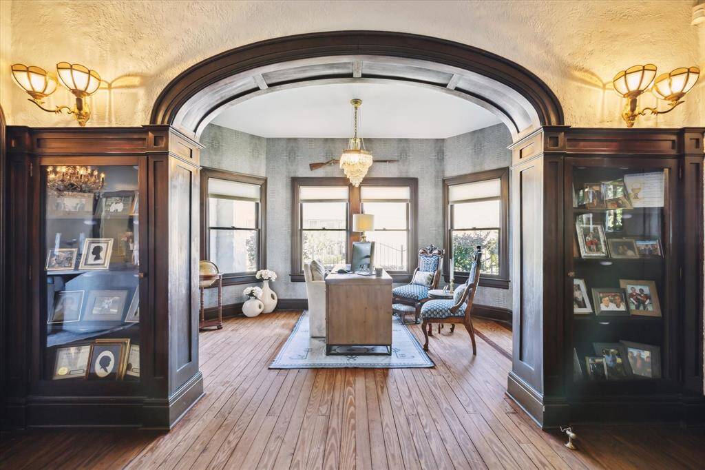 North wall of the living room has two original built-in display cabinets to hold family treasures.