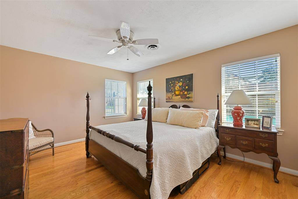 You will find plenty of space in this primary bedroom, even with a King size bed.