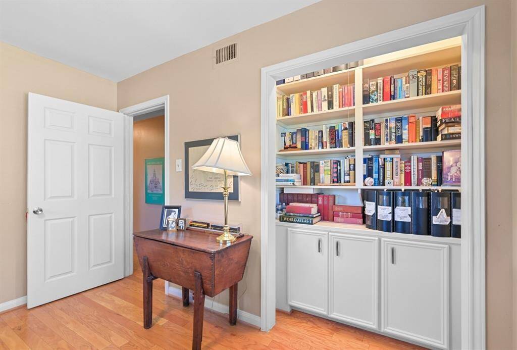 Built in bookshelves and cabinets have been added to the study