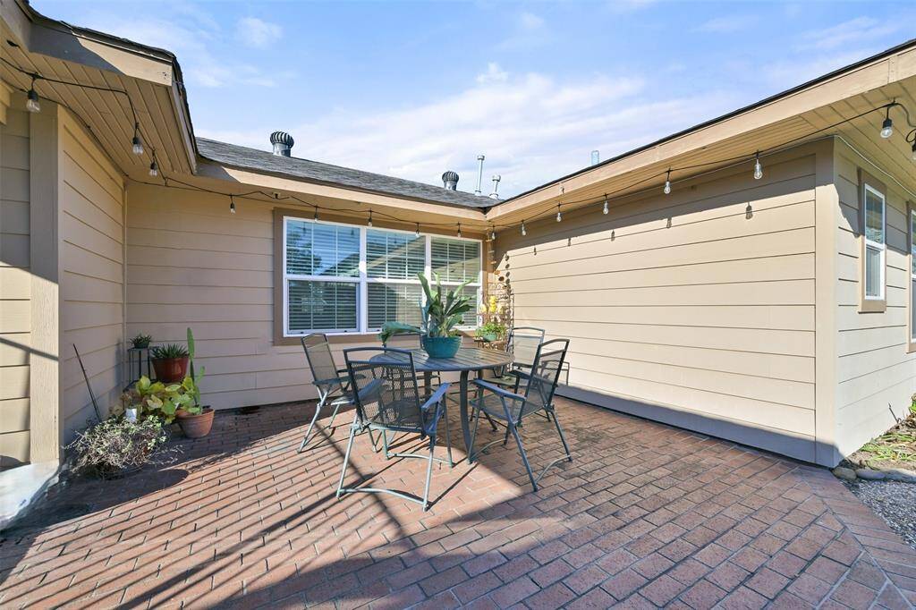 Imagine hosting lively summer gatherings and intimate evenings under the stars on the poolside brick patio