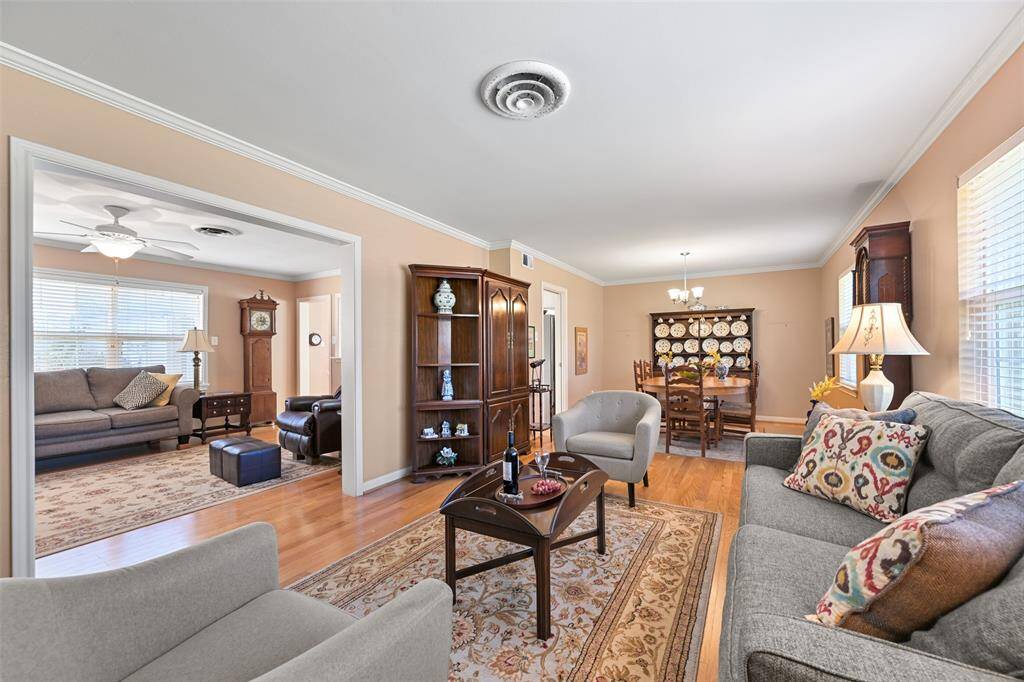 The living room opens to the dining area and secondary living space.
