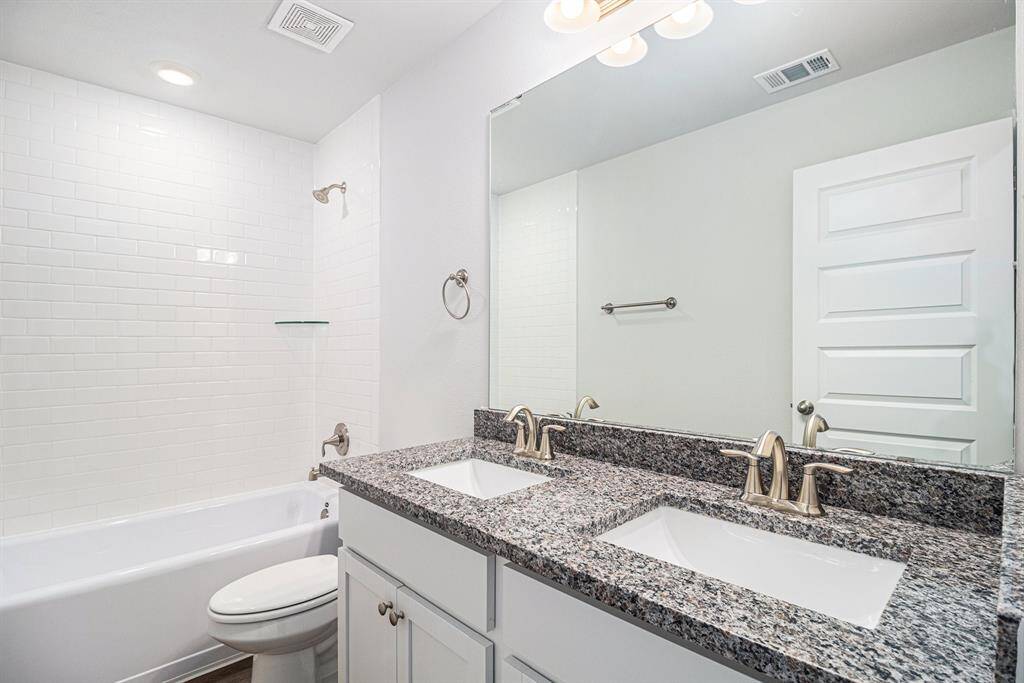Secondary Bathroom with Double Vanity Sinks
