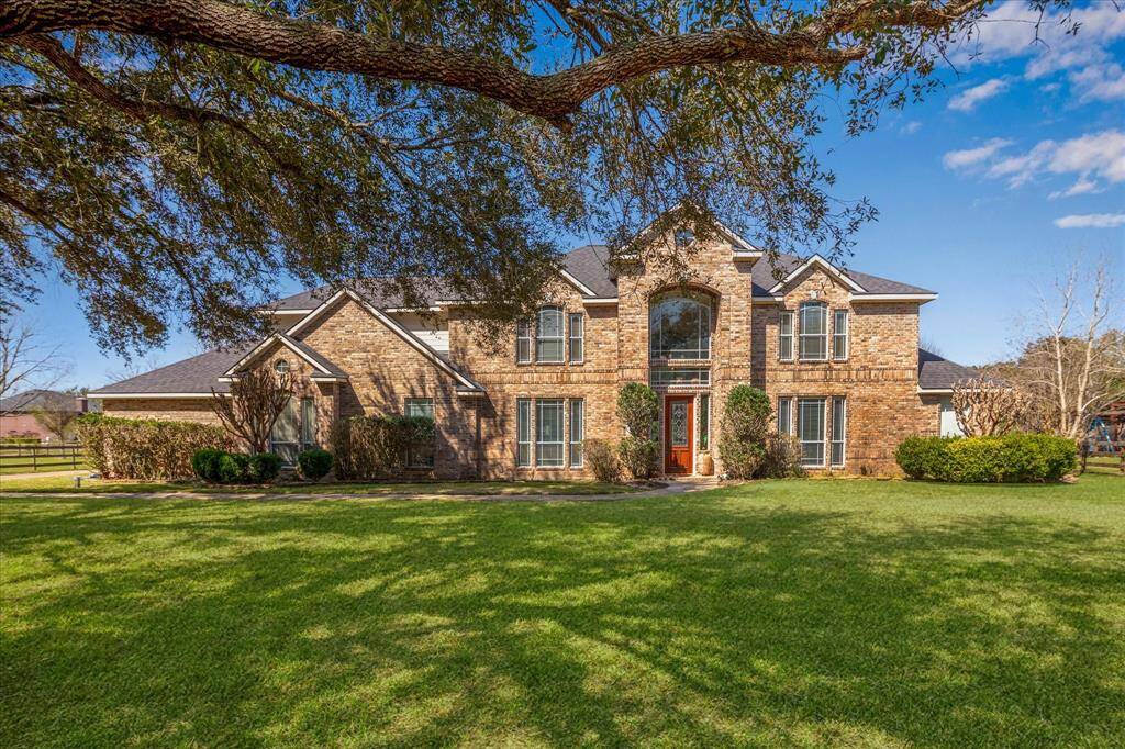 Front of the house. Live Oak Trees throughout the property