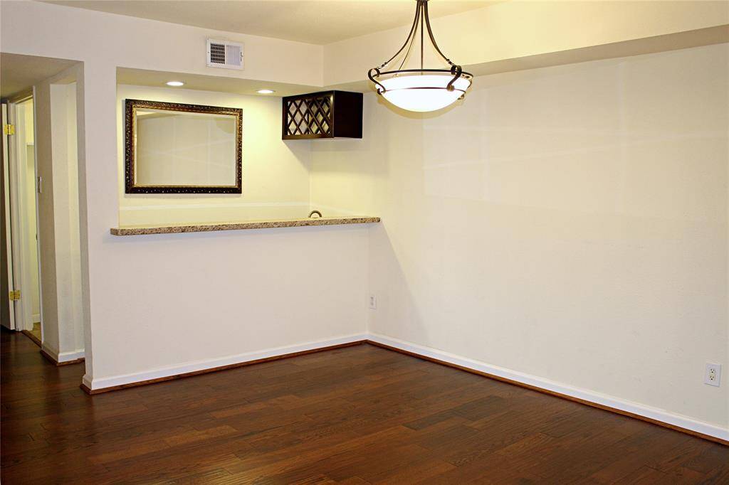 Dining area has a wet bar behind.