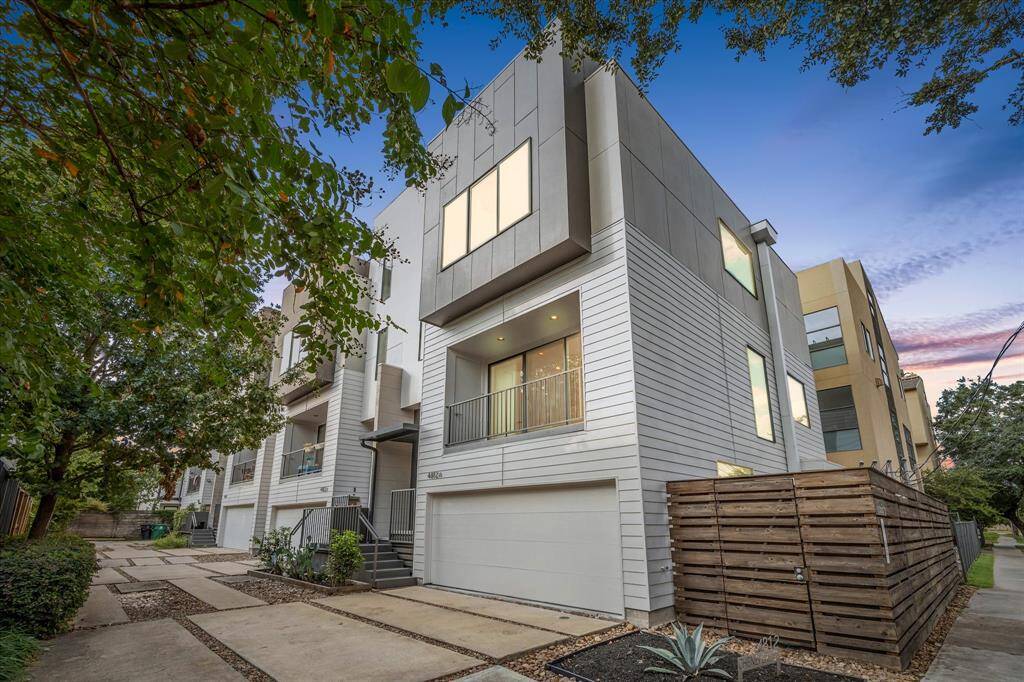 Corner unit surrounded by mature oak trees.
