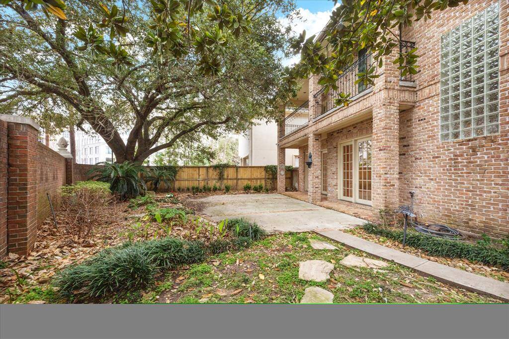 Alternate view of large backyard. The antique brick exterior is both beautiful and low maintenance.