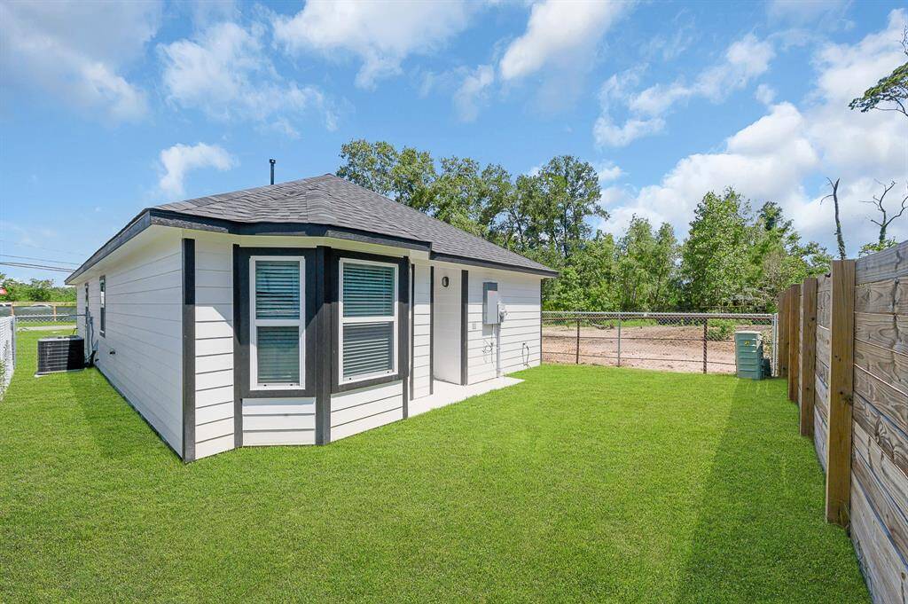 Long driveway with carport.
