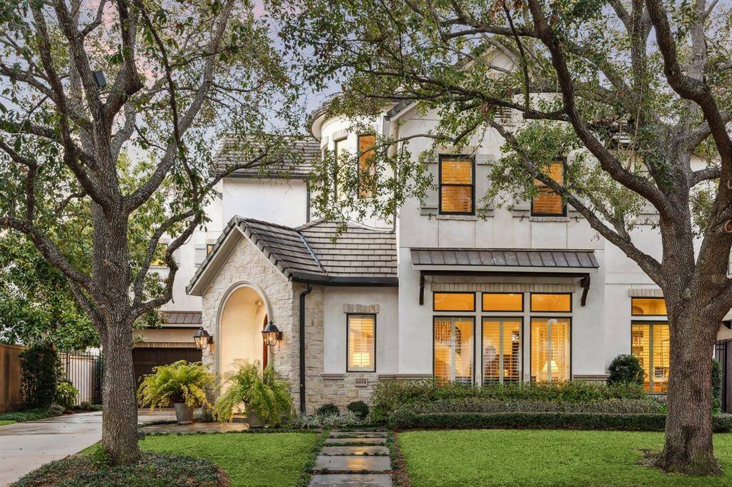 Impressive elevation of old world stucco & stone, concrete tile roof, mature/meticulously tended auto-irrigated landscape, and magnificent, dramatically lighted oaks. 6014 Floyd is just blocks from Memorial Park.
