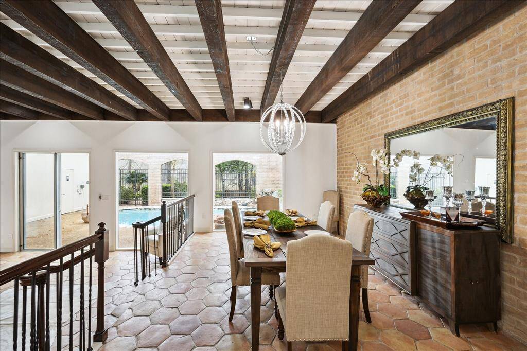 Spacious dining room (12' x 30') visible from the kitchen alcove, perfect for hosting 8 to 14 guests.