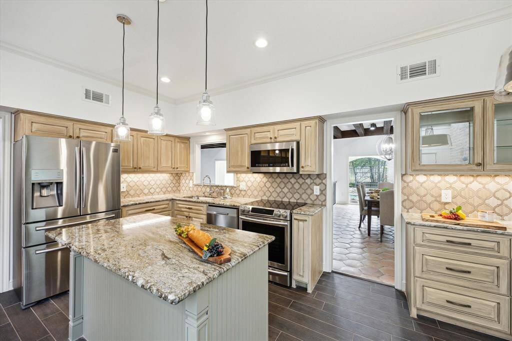Bright and inviting kitchen seen from the cozy breakfast nook.
