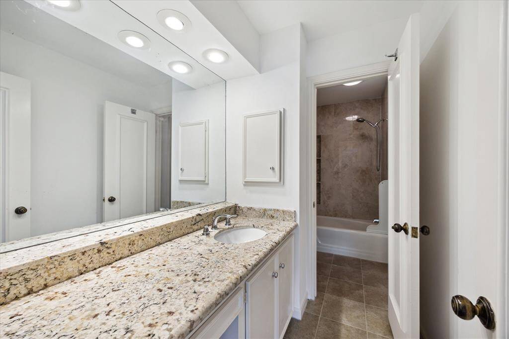 This stylish Jack and Jill bathroom conveniently links the two upstairs bedrooms.