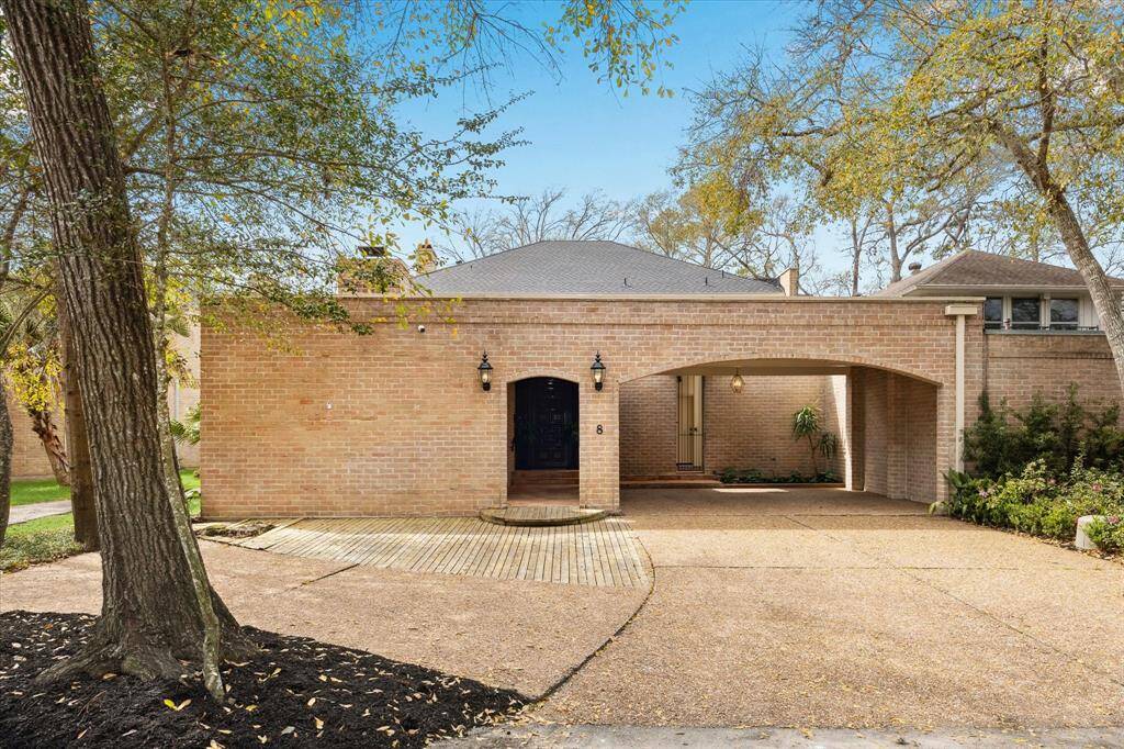 Discover the charm of 8 Woodstone, a historic townhome in a prime bayou-front community.