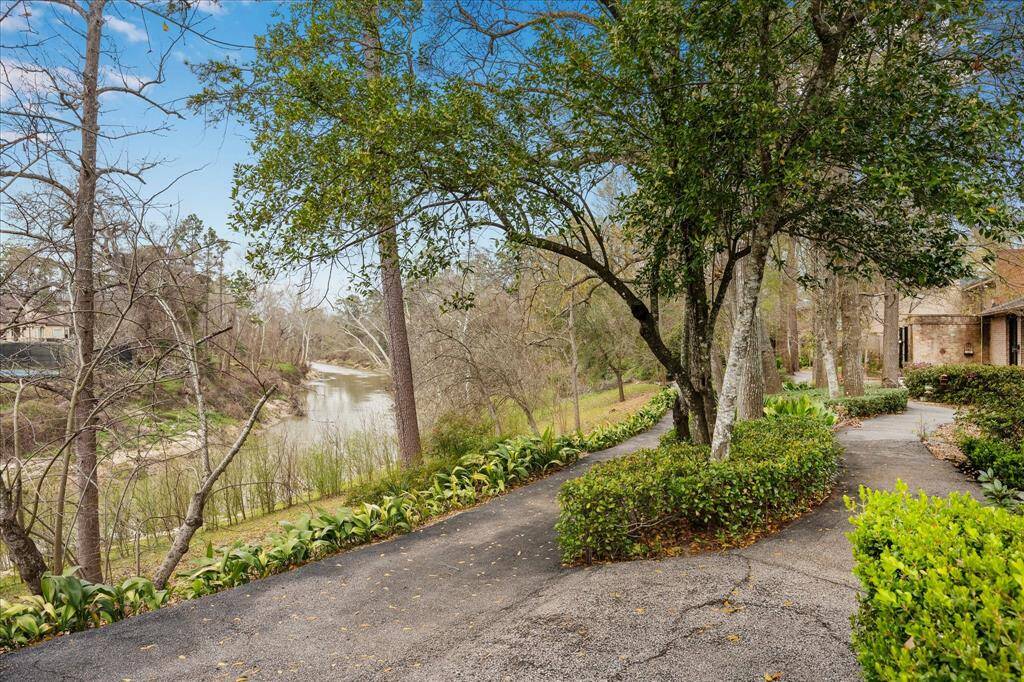 Enjoy serene Bayou views right from your backyard, with direct access to a picturesque walking trail.