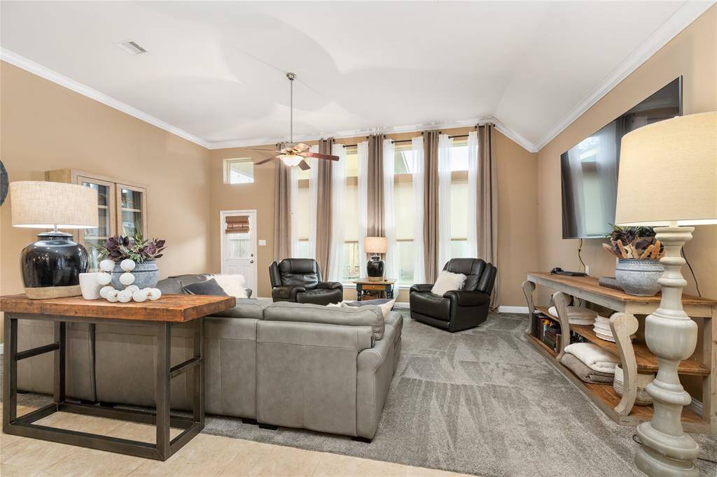 Floor-to-ceiling windows let lots of natural light into the Living Room