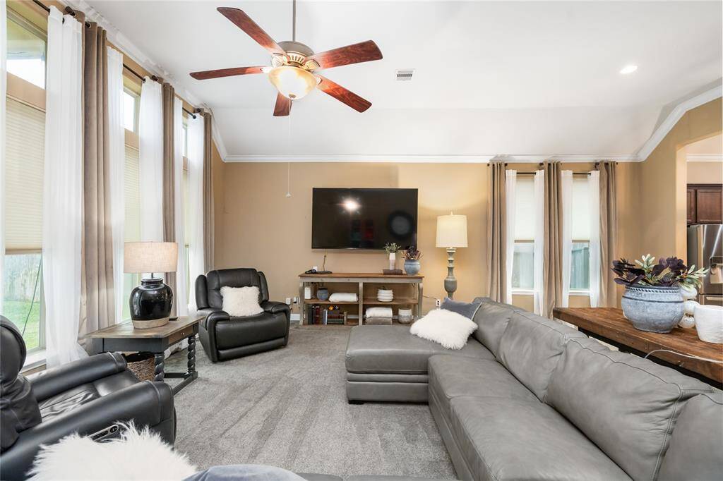 The home features high ceilings and crown molding