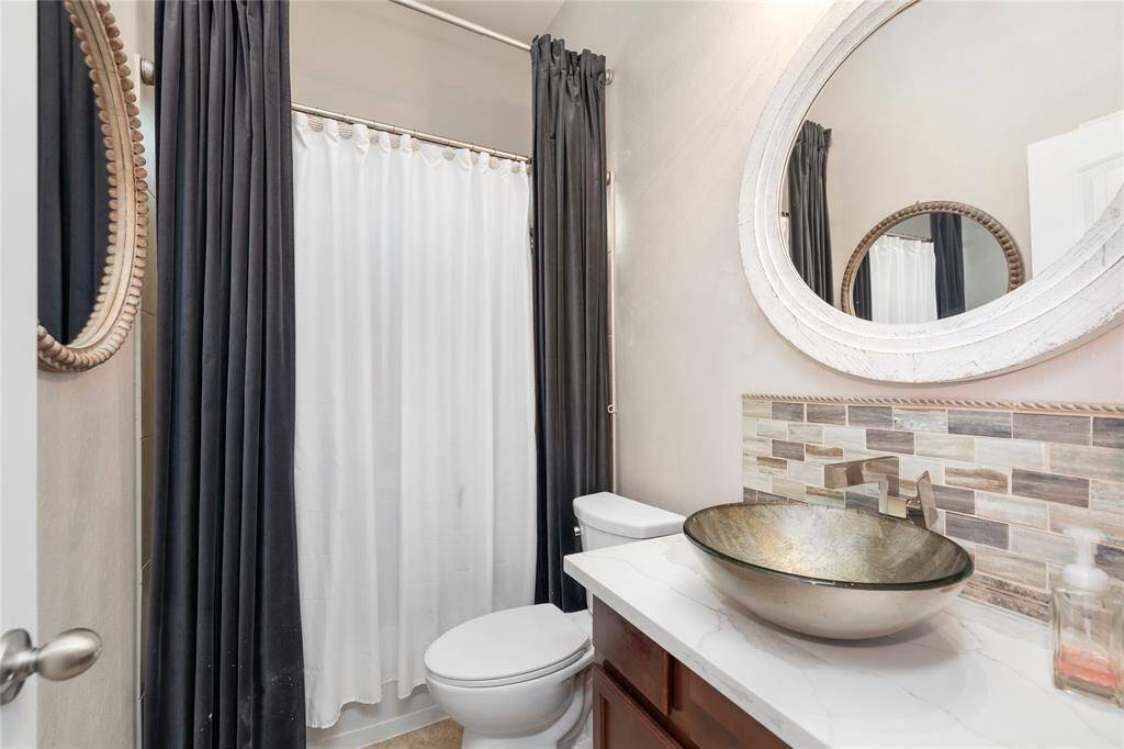 The lovely second bathroom has been beautifully updated