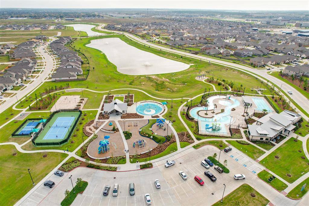 Residents enjoy pickleball and tennis courts, multiple pools, playgrounds, splash pad, and clubhouse!