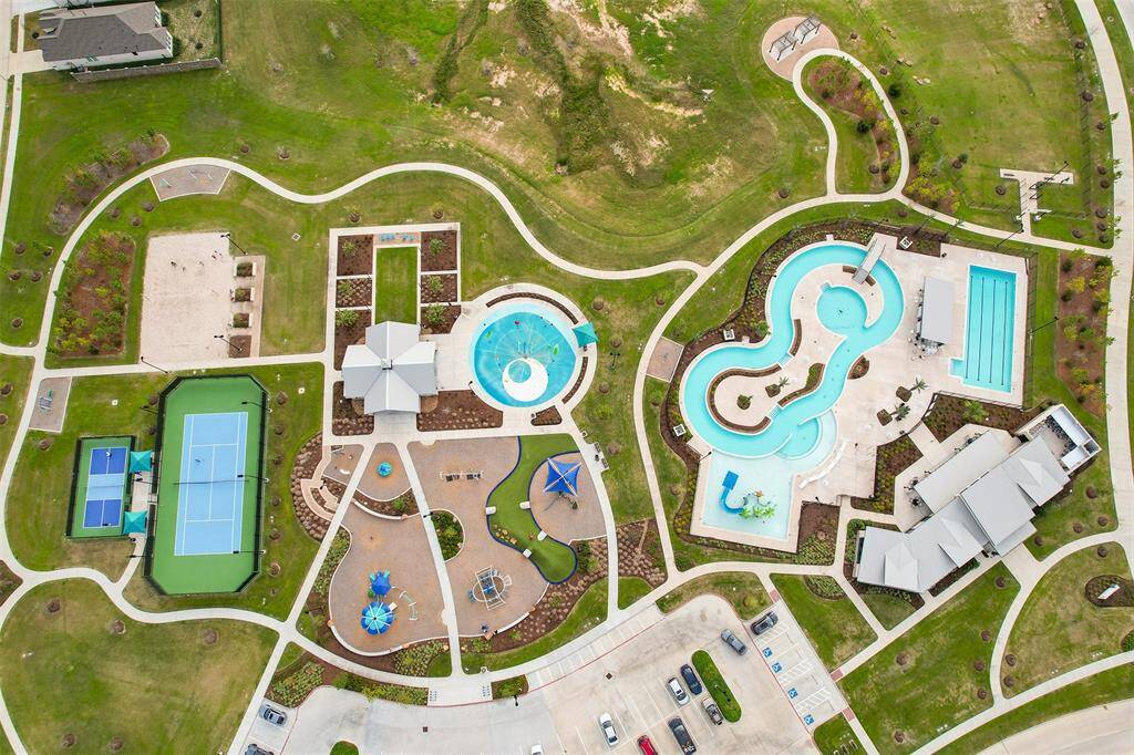 Residents enjoy pickleball and tennis courts, multiple pools, playgrounds, splash pad, and clubhouse!