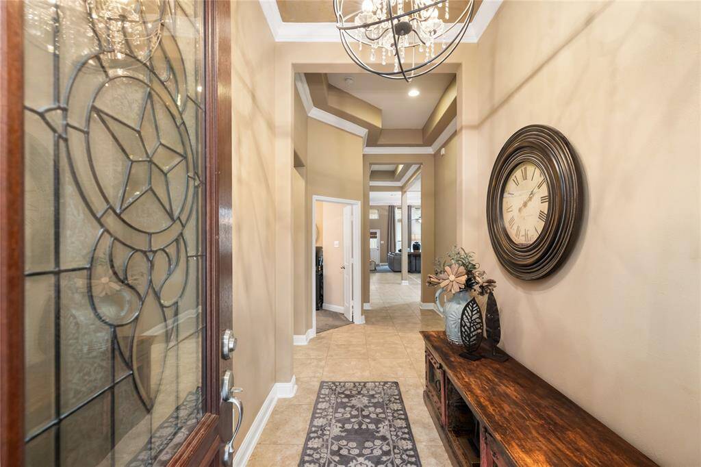 The solid wood and leaded glass opens into the foyer