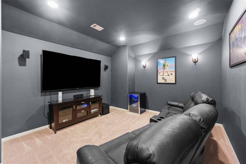 Imagine a cozy movie night in the media room, where the immersive atmosphere and ample seating create the perfect setting for endless entertainment.