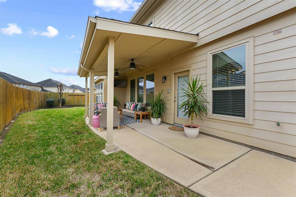 The spacious covered patio is complete with a television and ceiling fans to keep you cool as you enjoy the outdoor living space. It’s the perfect spot to relax, entertain, or simply unwind while enjoying the fresh air.