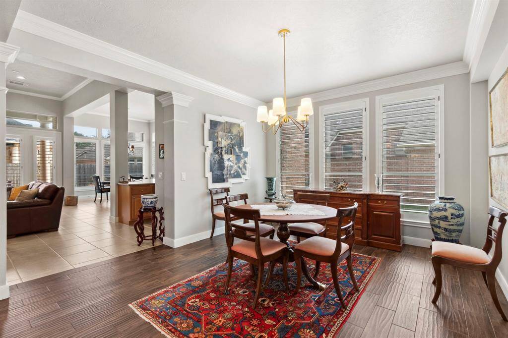 A new light fixture graces the dining room which is also open to the family room & kitchen areas.