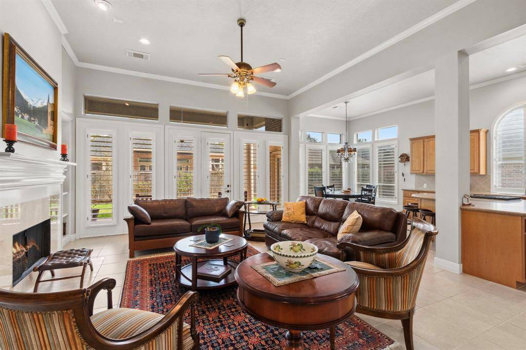 An incredible open floor plan with an abundance of natural light.  The family room, kitchen & breakfast areas connect giving the space a grand feel that is still warm & welcoming.  Windows from every side enhance the views as light pours in.  Plantation shutters offer a touch of luxury.