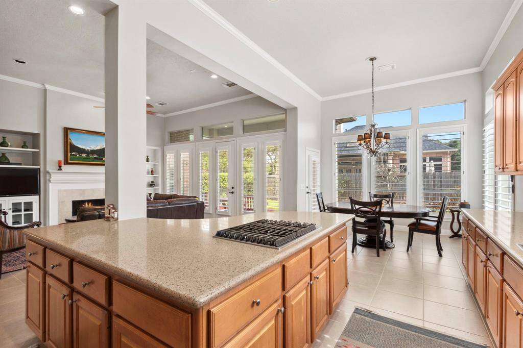 A substantial island separates the space and provides an ample cabinet storage.