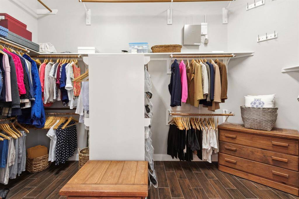 A partial view of the huge walk-in closet that offers built-in amenities.