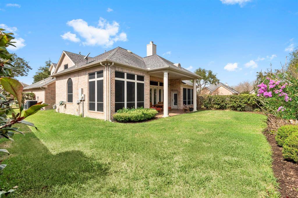 Full brick surround exterior with solar shades on the back & sides of home, full sprinkler system & full gutters.  Ample yard space & a privacy fence adorned with climbing vines.