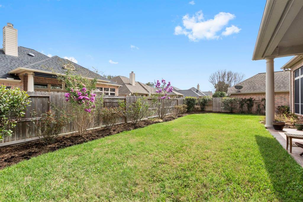 The backyard offers the right amount of space for enjoyment & keeps maintenance low.