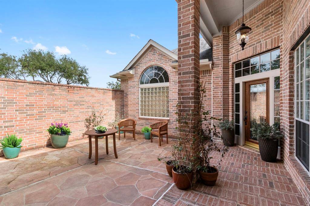 A private courtyard area that is privacy gated for security. Entrance to the main house & casita from the courtyard. Full brick surround & flagstone patio.