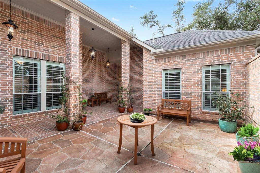 The courtyard area is a charming space that offers privacy. Looking back towards the gated entry, you see the casita windows on the right.