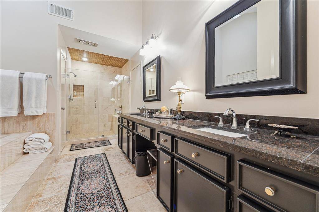 An adjoining flex room offers a versatile space perfect for a home office, nursery, or private gym. Large windows fill the room with natural light, with a glass door leading to the back patio.