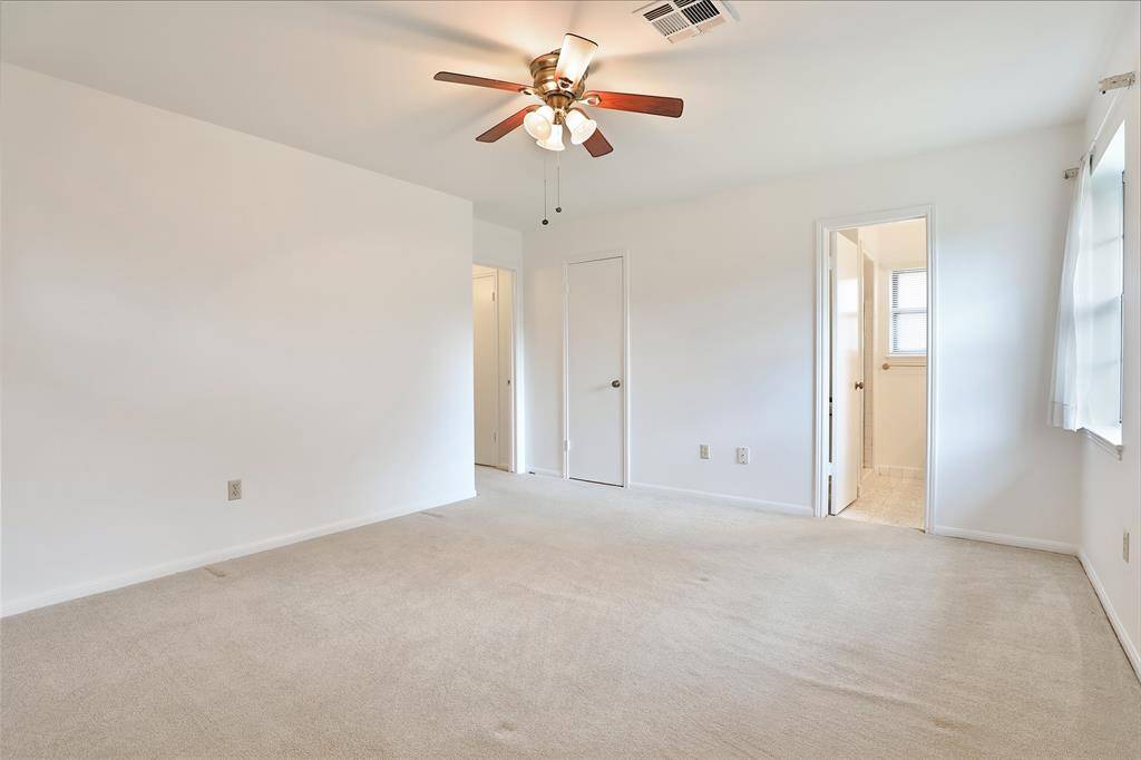 Primary bedroom features large walk in closet and ensuite bathroom.