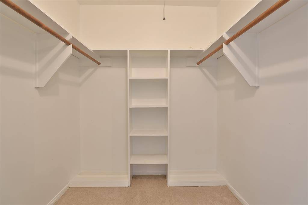 Primary bedroom walk in closet.  There is also another closet this size down the hall.