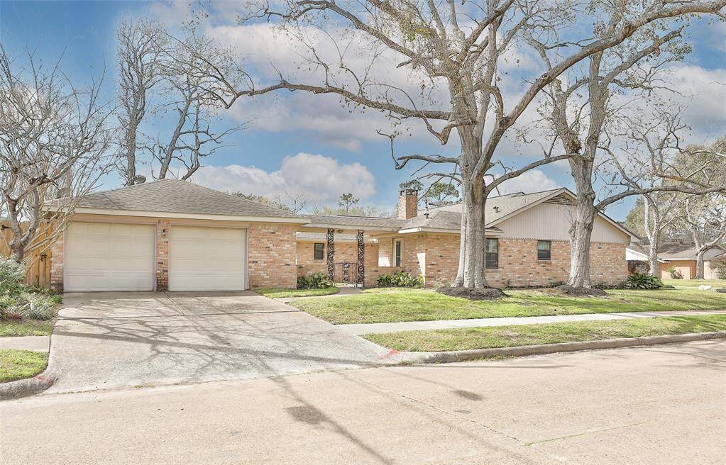 Being on a corner lot, this home also features a 2 car garage with work bench.