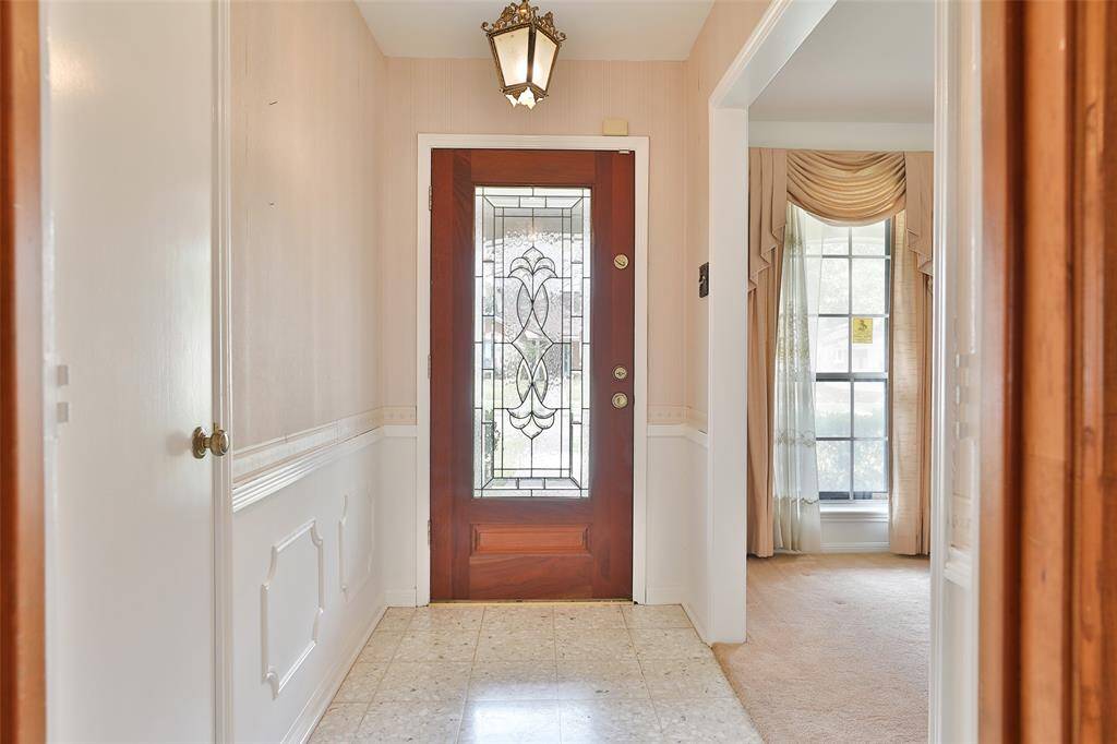 Beautiful entry way with glass leaded front door!