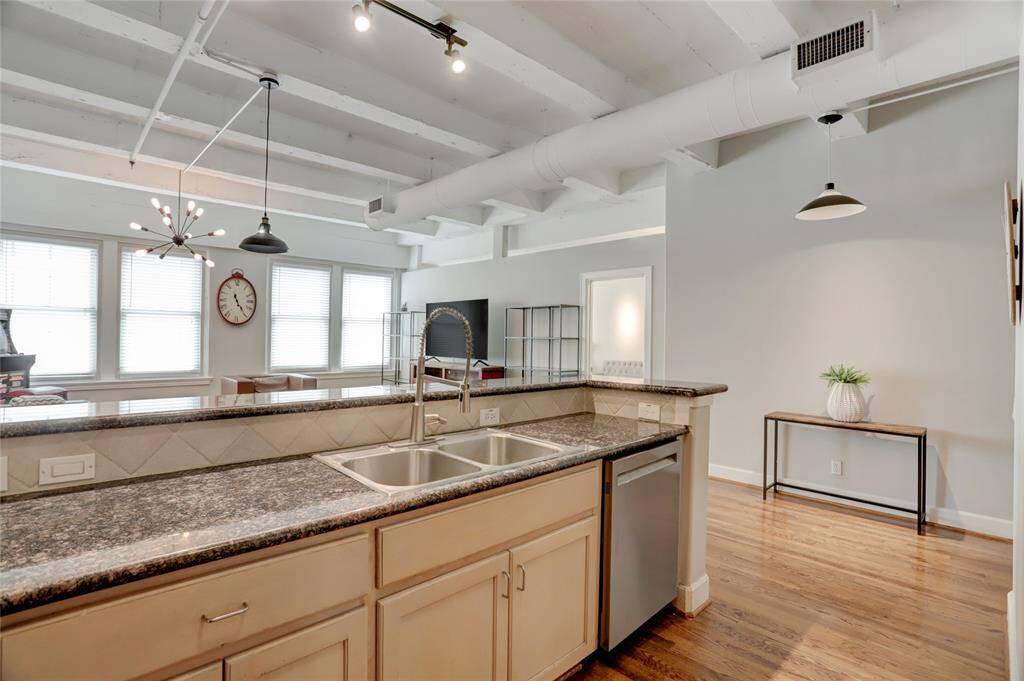From this angle, you can see how the kitchen opens up to the living space, creating an inviting and spacious layout. This open design is perfect for entertaining, allowing you to easily interact with guests while preparing meals.