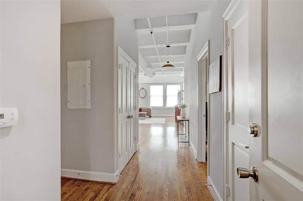 As you enter the unit, you're greeted by a welcoming foyer. To the left, you'll find the bathroom, while the primary bedroom is situated to the right. Further down, the open living space unfolds, offering a bright and airy atmosphere.