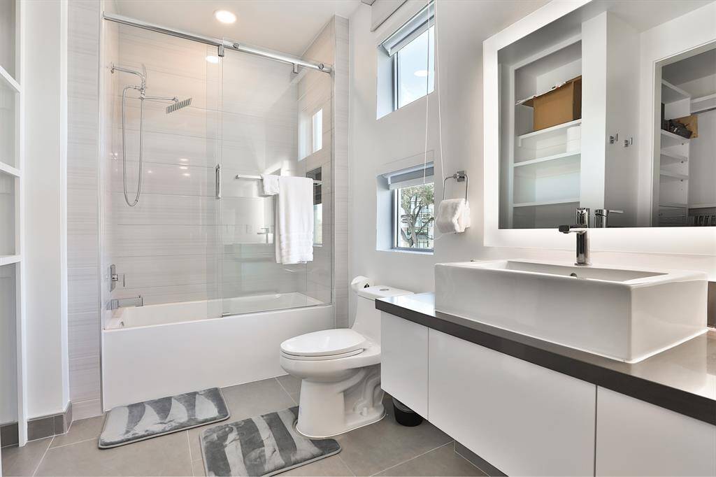 Emser citadel gray 24x35 tiles accent the floor giving a Zen spa like feel to each of the upstairs bathrooms.