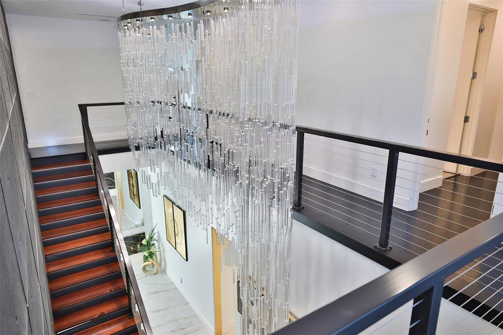Simply stunning! This bespoke chandelier hung with the upmost opulance is one of a kind and designed by the thoughtful owner.