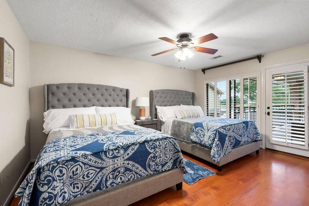 Spacious upstairs third bedroom with abundant natural light.