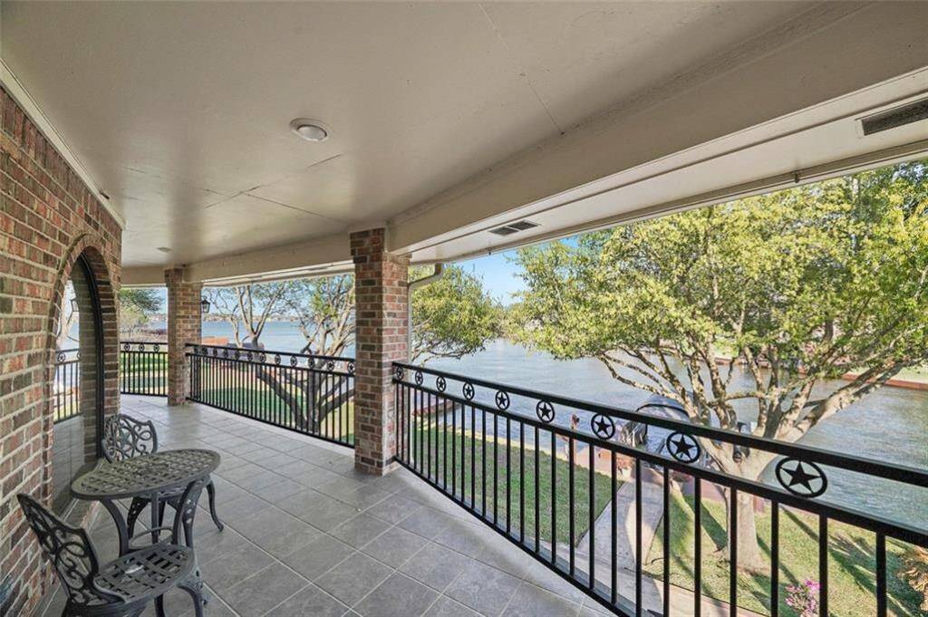 Expansive upstairs balcony offering stunning water views—perfect for relaxing or entertaining.
