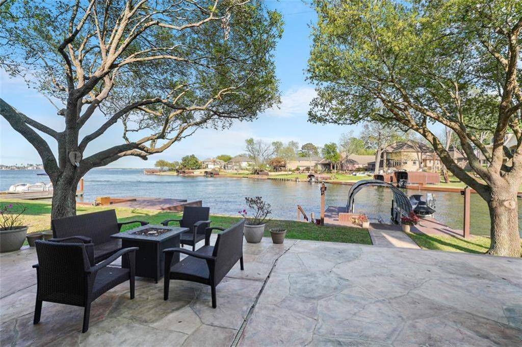 Relax on this stunning waterfront patio, perfect for entertaining or enjoying serene views.