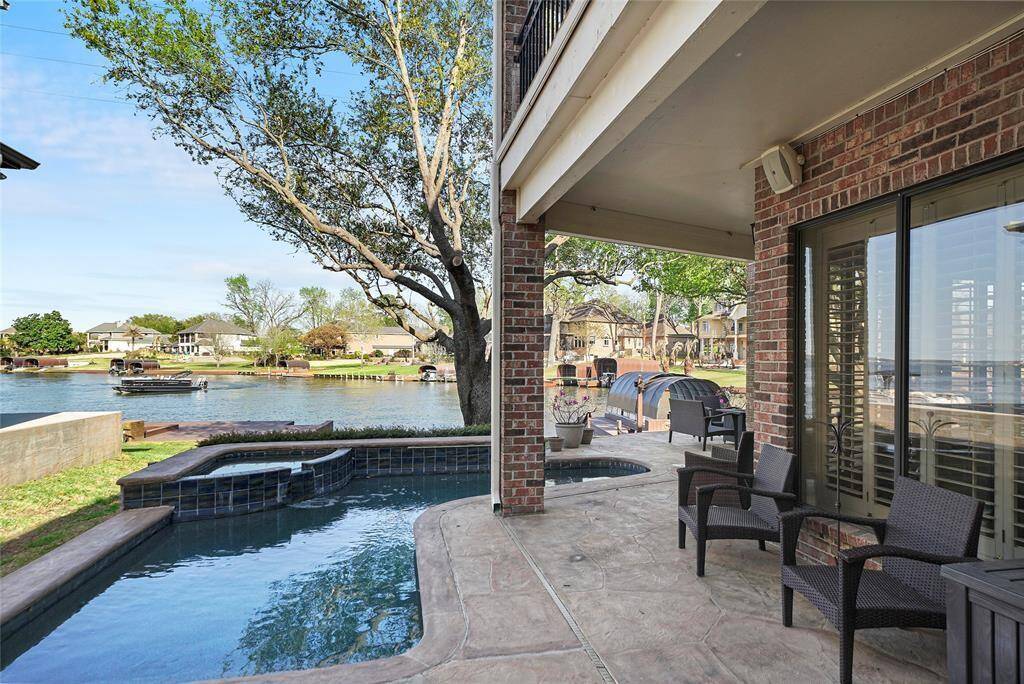 Relax and entertain in style with a stunning pool and spacious patio, offering picturesque waterfront views. Perfect for unwinding or hosting gatherings.