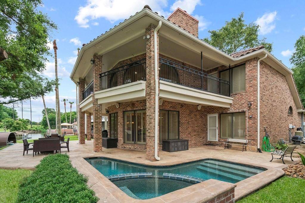 Enjoy a private oasis with this elegant backyard pool, perfect for relaxation and entertaining in a stunning setting.