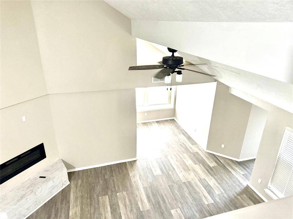 landing from 2nd floor bedroom over looks the living room